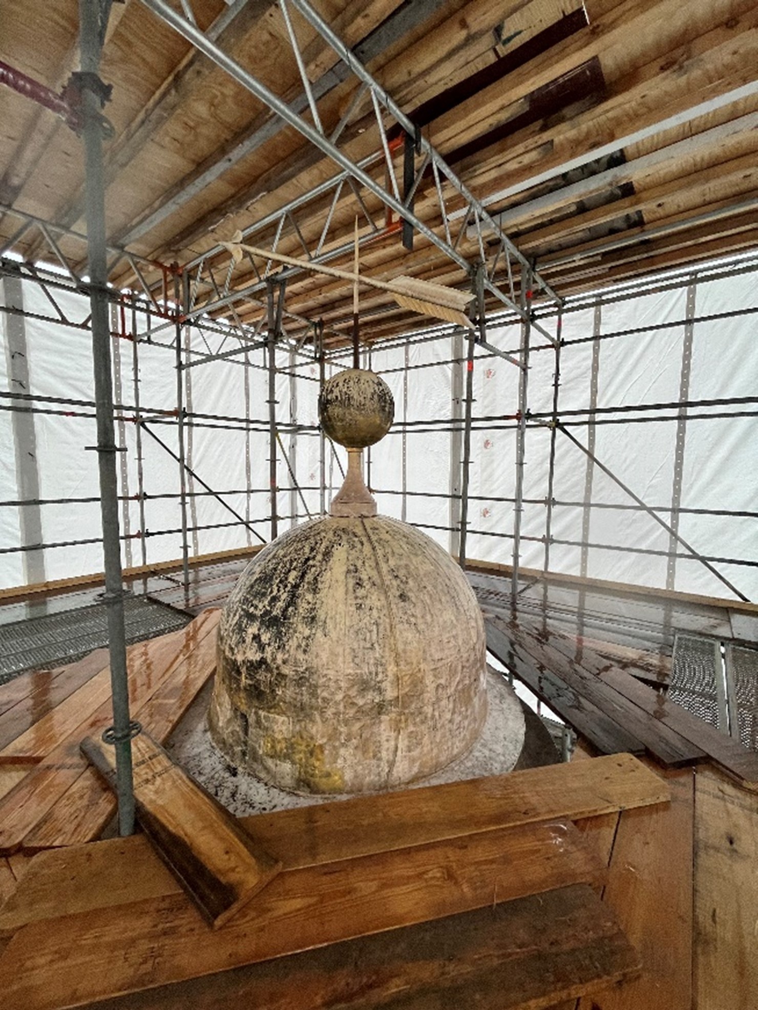 Tower dome surrounded by scaffolding.