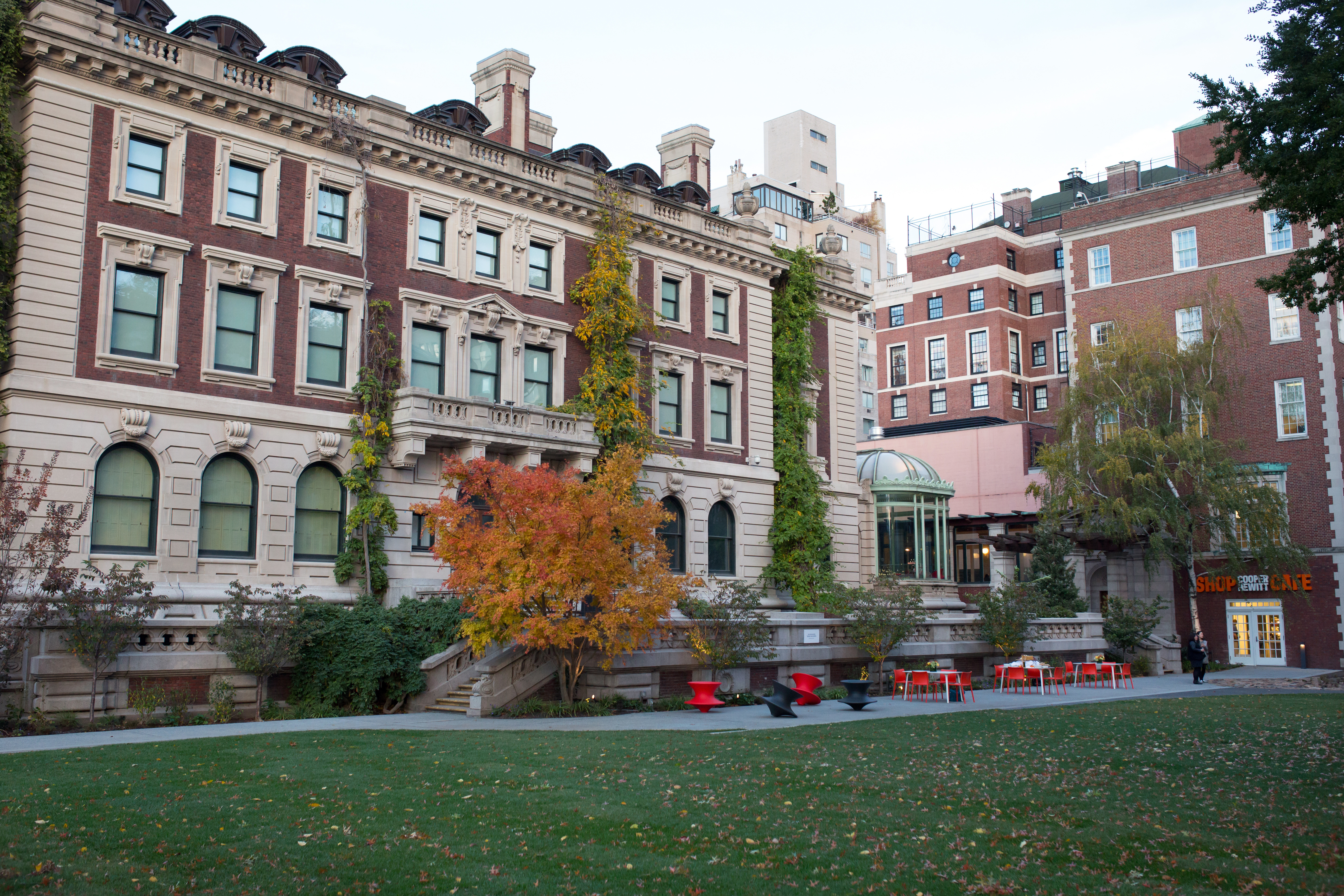 Exterior image of the Cooper-Hewitt Museum showing the garden lawn.