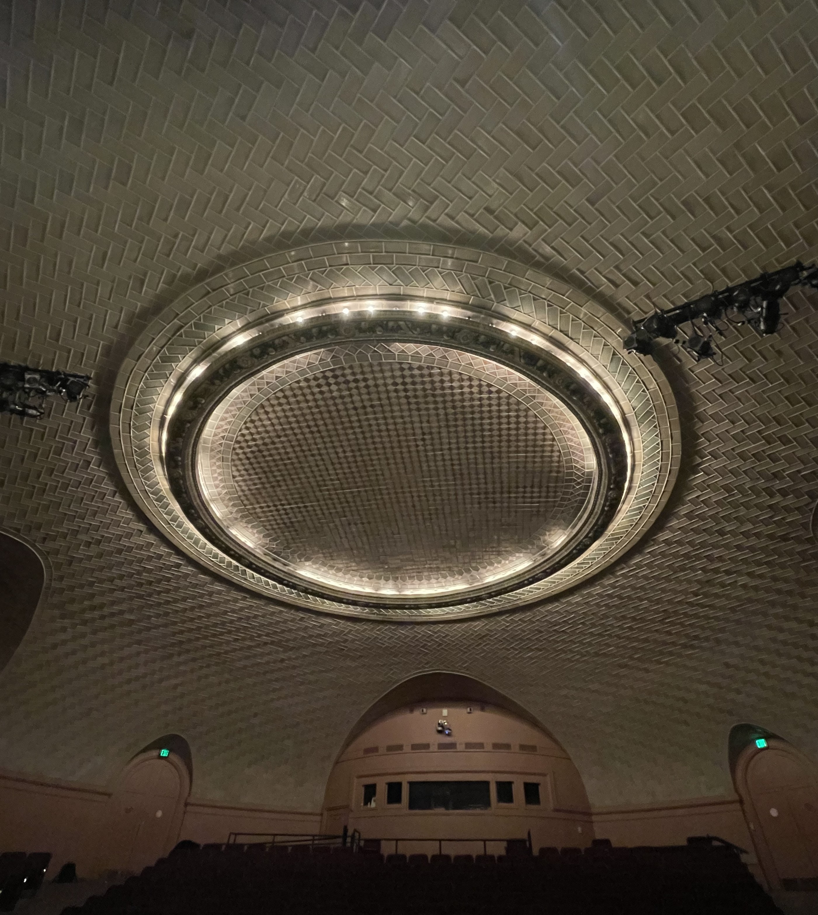 Modern image of the round terracotta center ring of the Baird Auditorium dome ceiling.