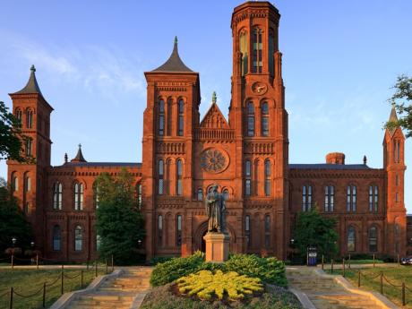 Image of the Smithsonian Castle, a red stone building.